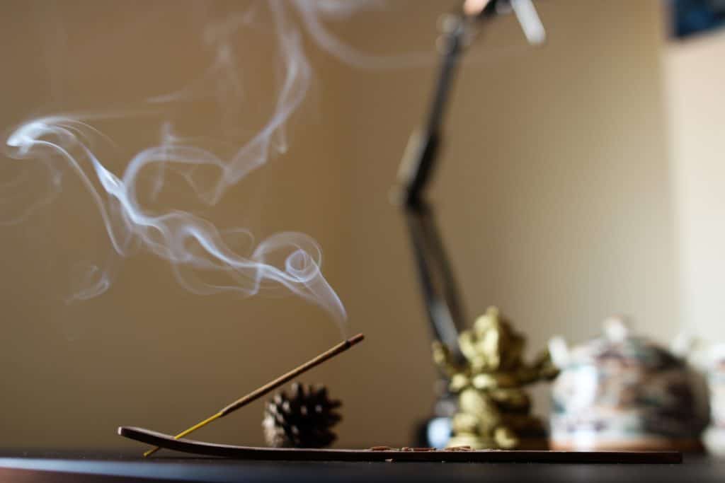 burning incense for root chakra