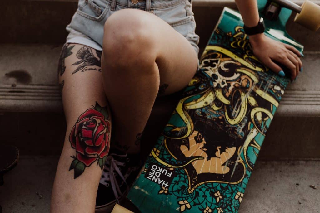 bold red rose tattoo design skater