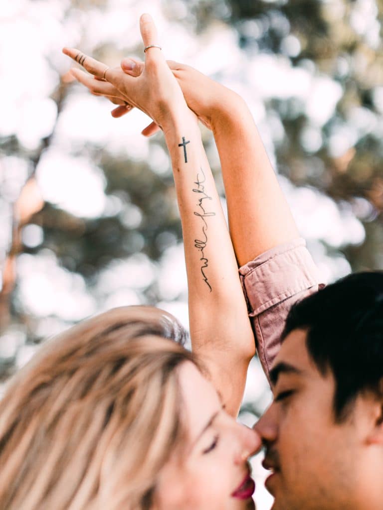 cross tattoo with font