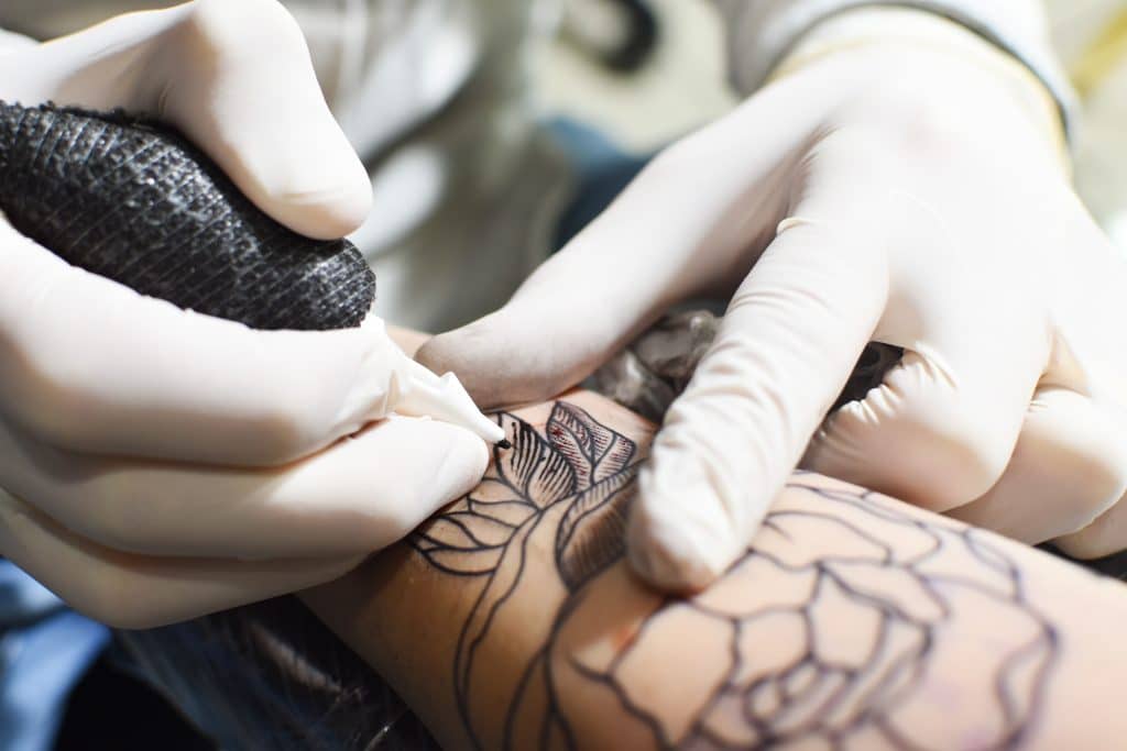 tattoo artist working