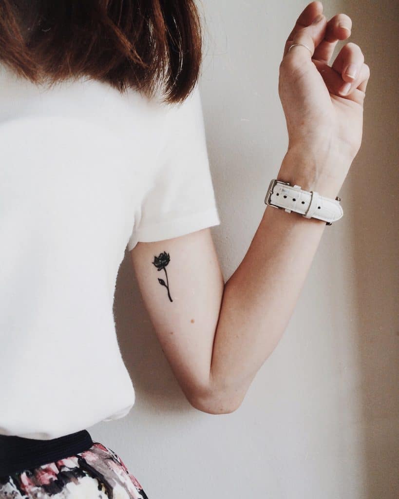 minimalist small rose tattoo