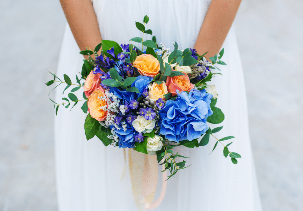 bold bright blue orange wedding flowers