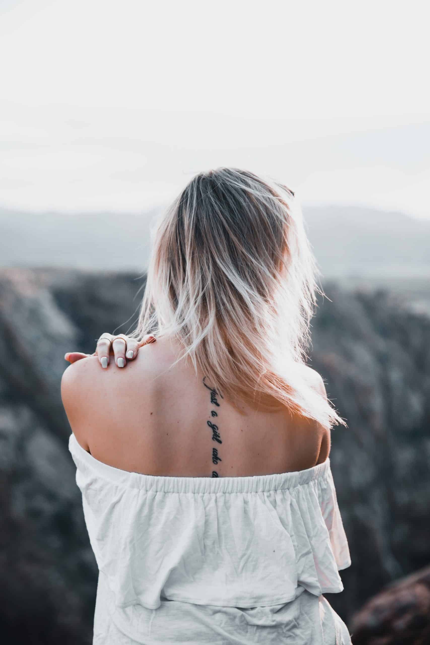 back tattoo with writing quote