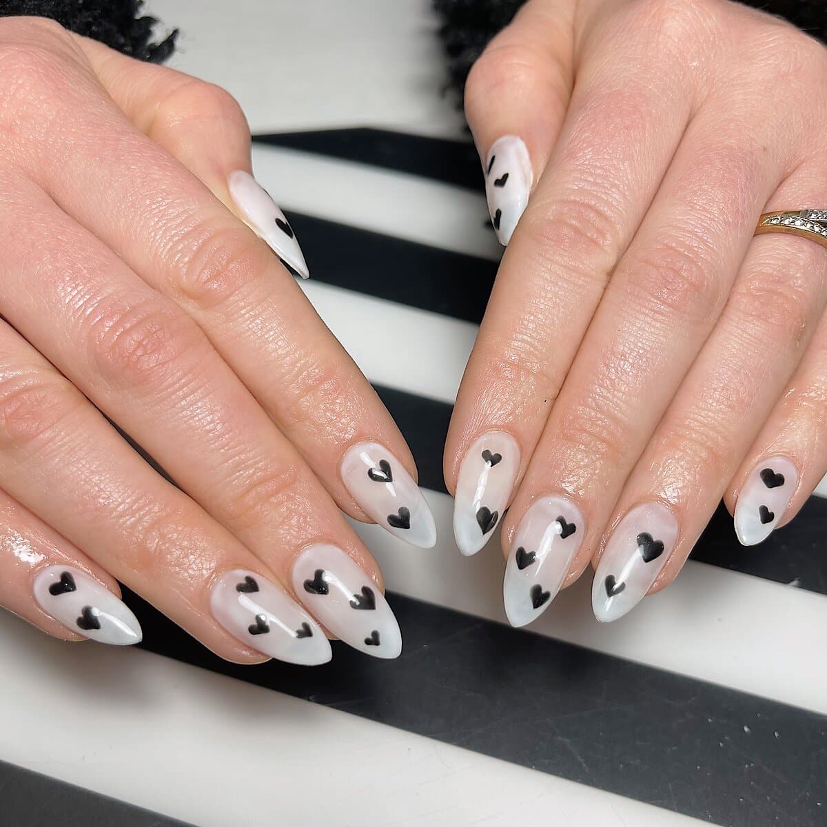 valentines nail design with black hearts on white base