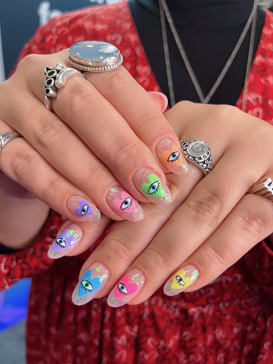 colorful quirky valentines nail design, with eyes