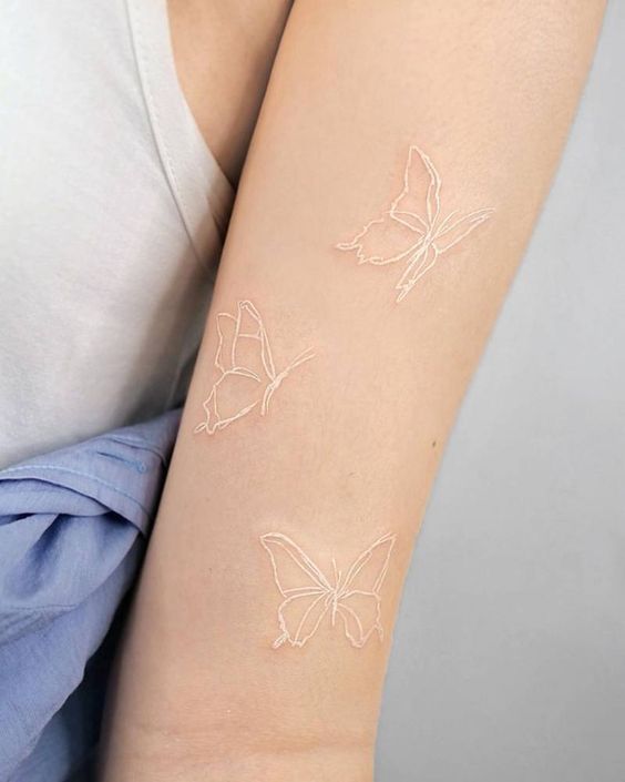 white ink butterfly tattoo