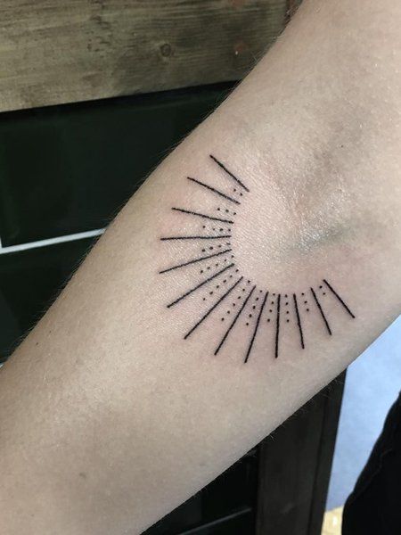 dots and lines sun tattoo