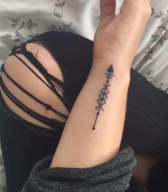 combined runes and arrows viking tattoo for women