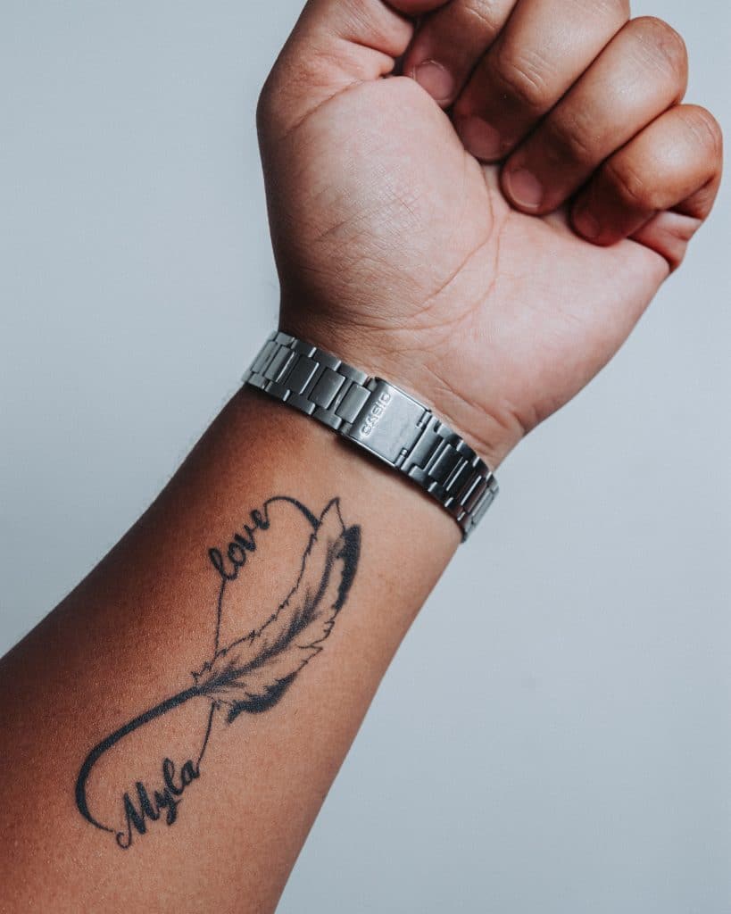 feather infinity symbol tattoo 