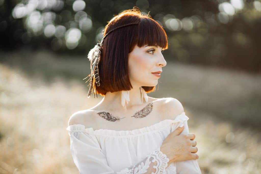 collarbone feather tattoo 