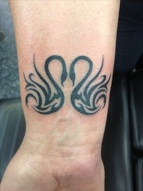 tribal swan tattoo heart