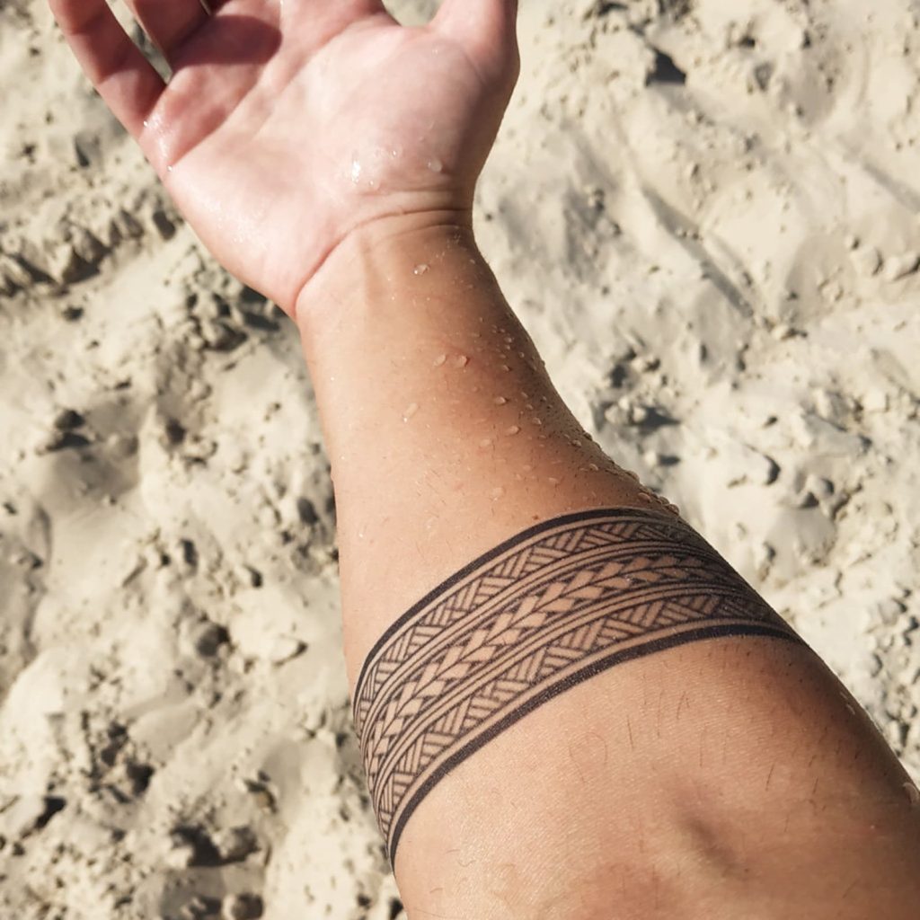Maori tribal two line tattoo idea