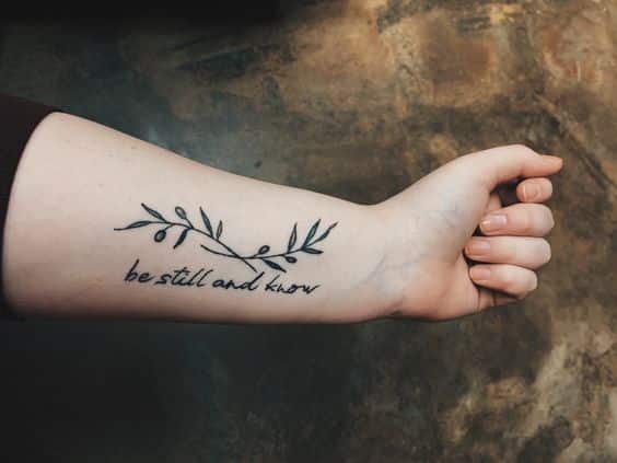 olive branch tattoo with the words be stll and know