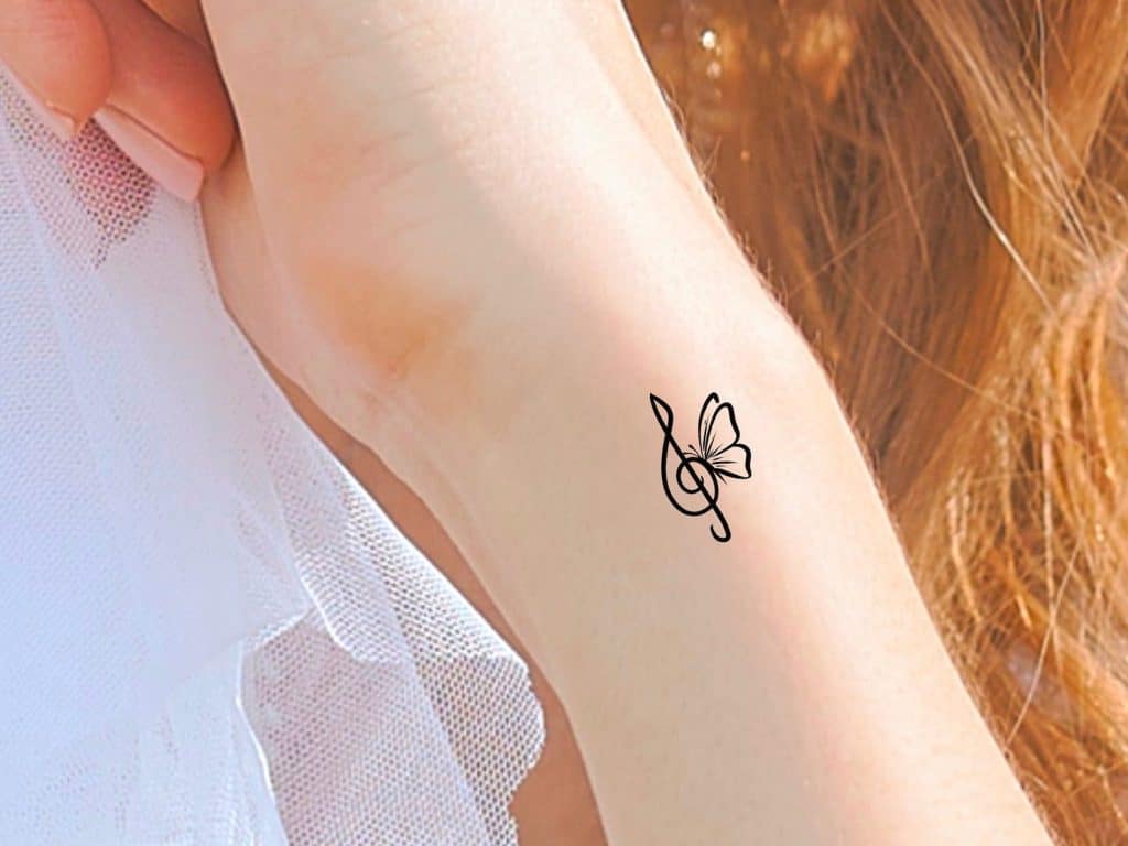 music note tattoo with butterfly 