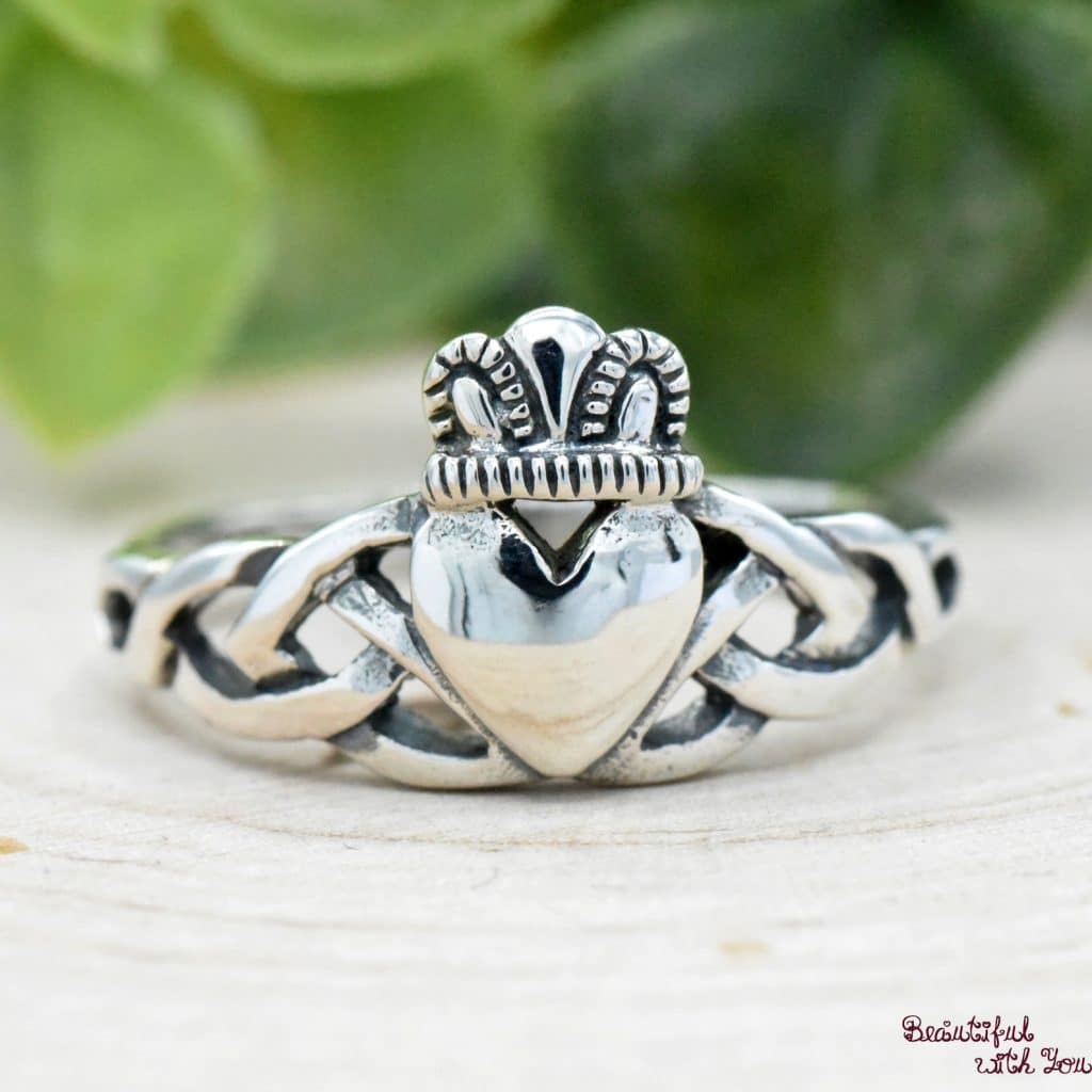 silver claddagh ring with celtic knot band