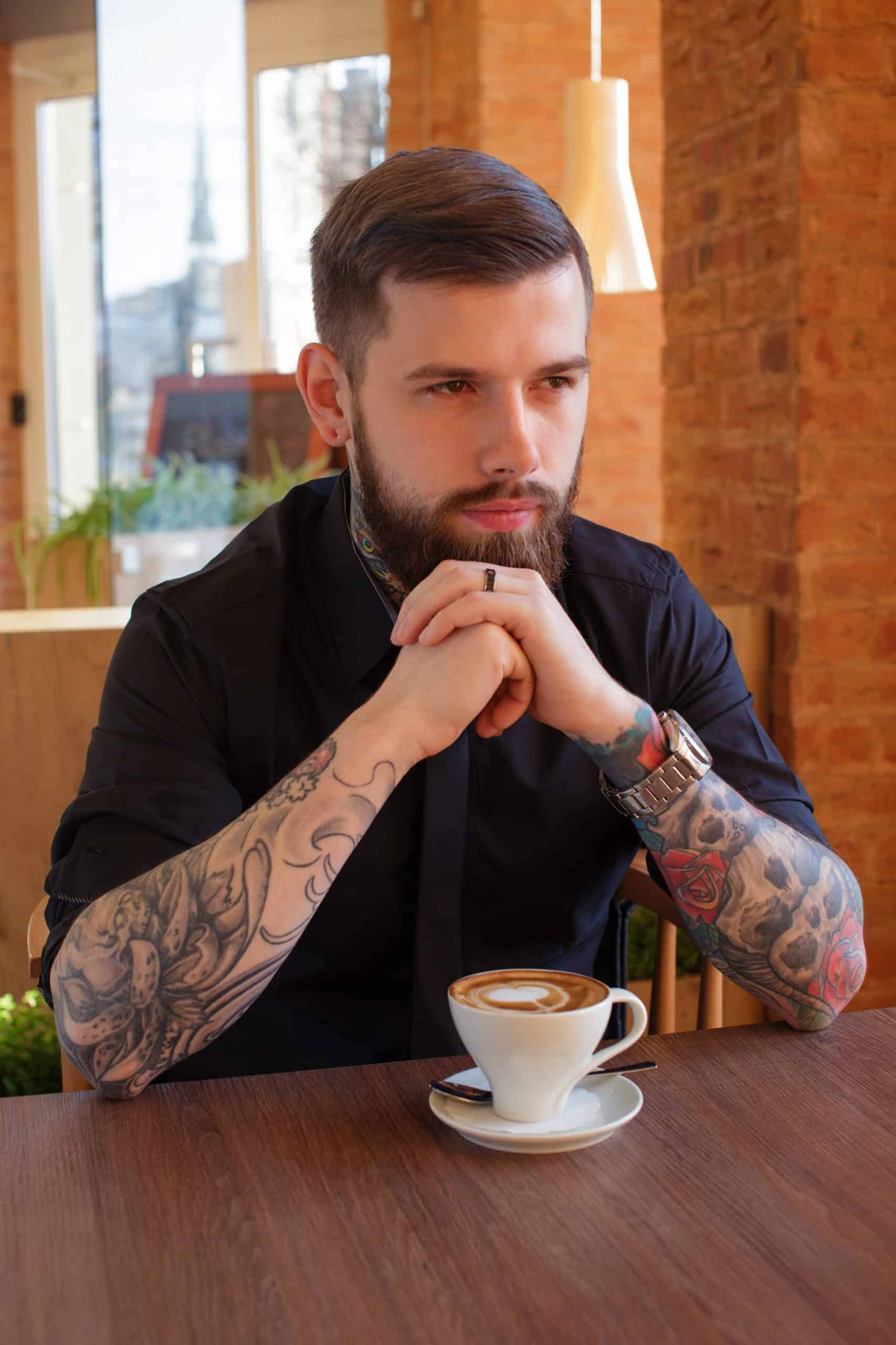 skull and rose tattoo on a man