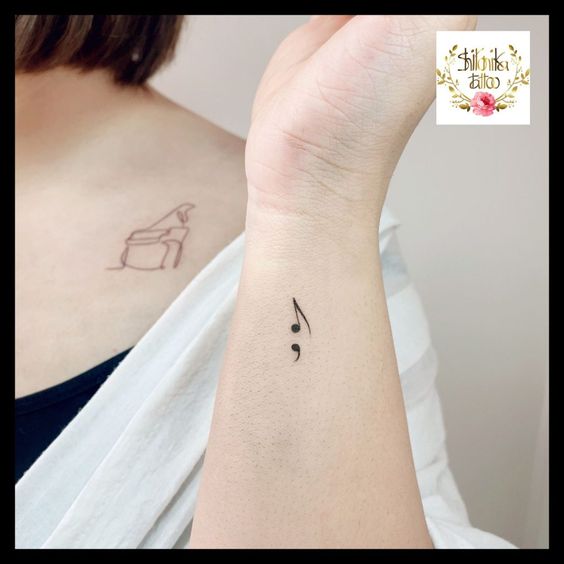 music note tattoo with semi Colon 