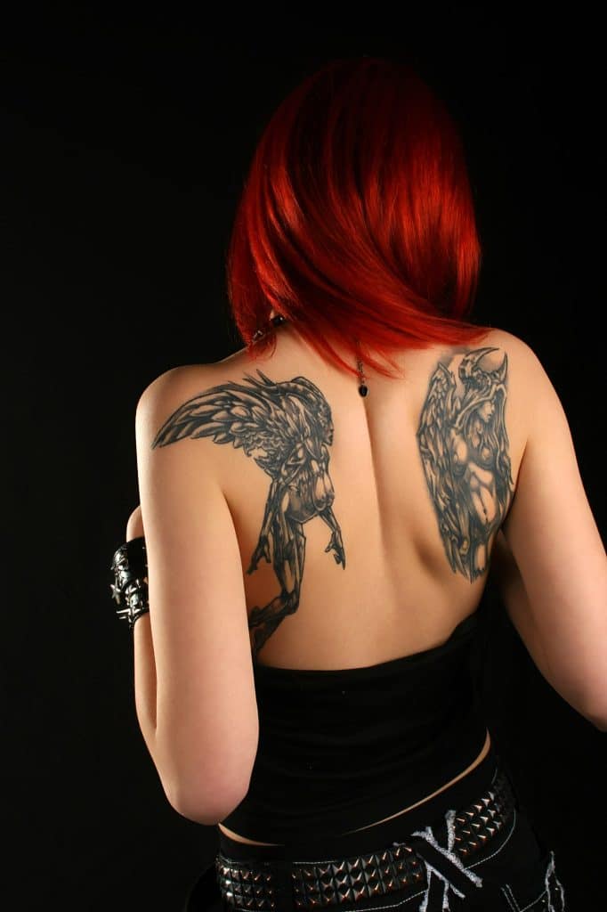 dark side of an angel wings tattoo on back