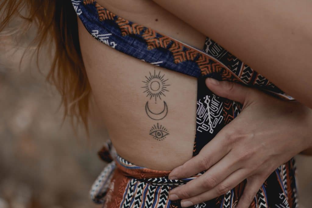 sun moon and eye tattoo