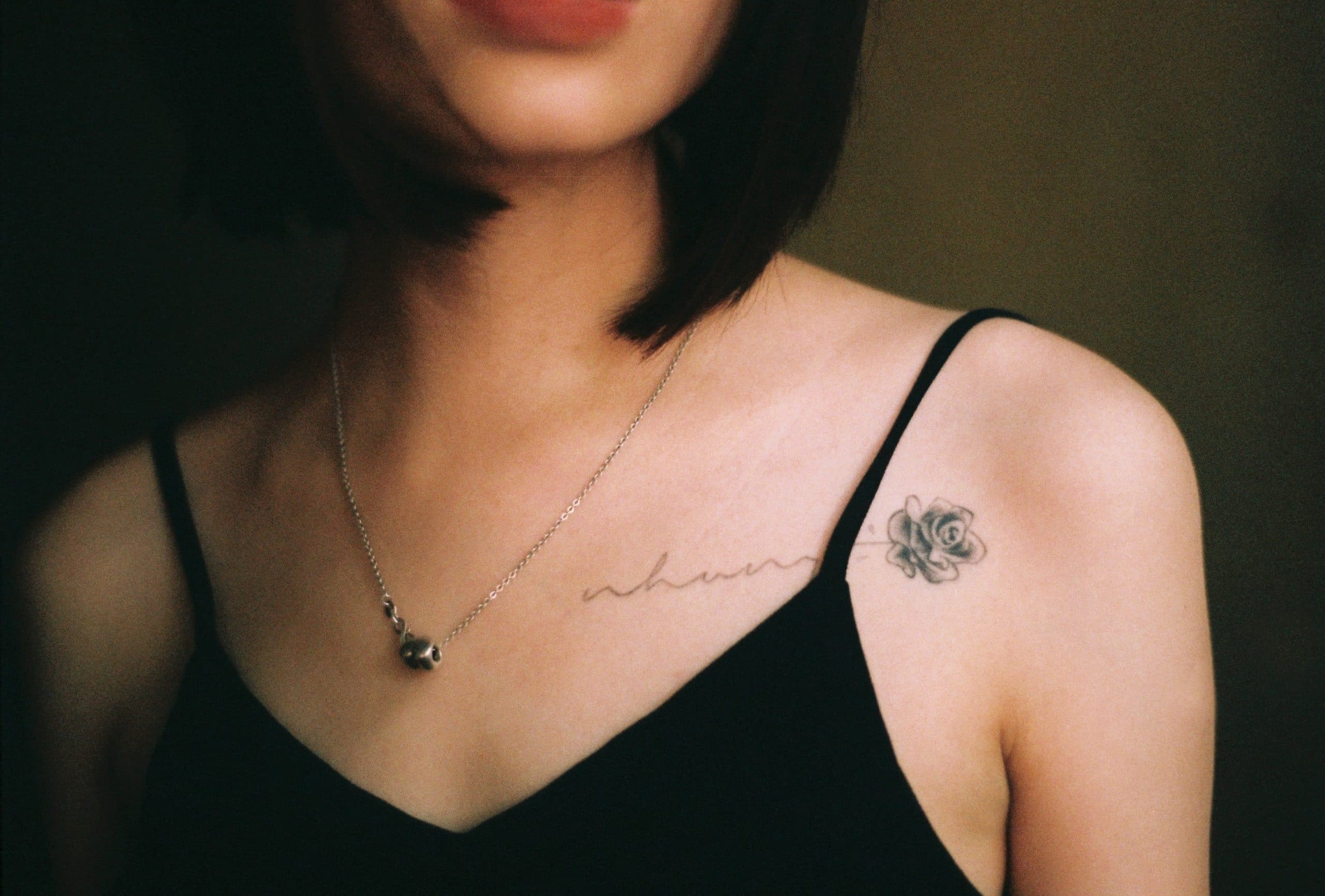 line art minimalist rose tattoo on collar bone