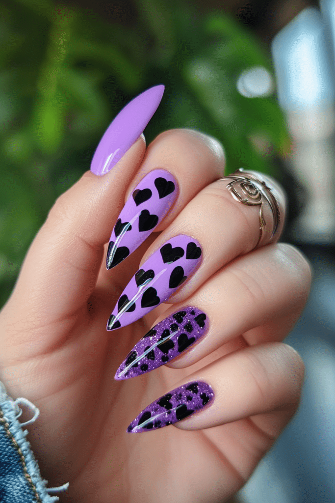 stiletto purple nails with black hearts simple valentines nail art