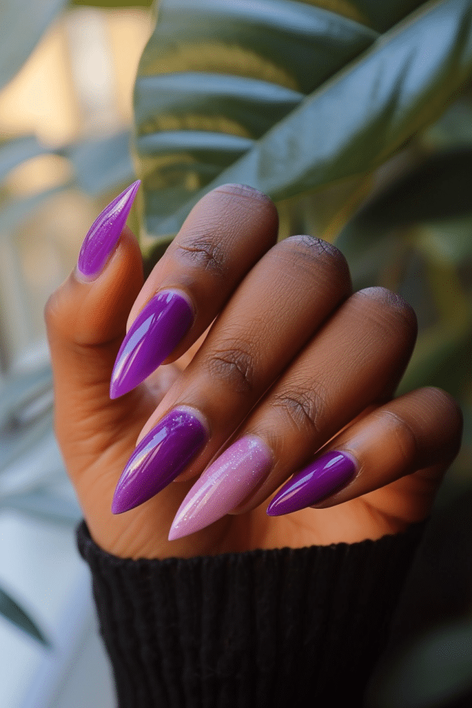 different shades of purple nails with pink feature nail, on black skin