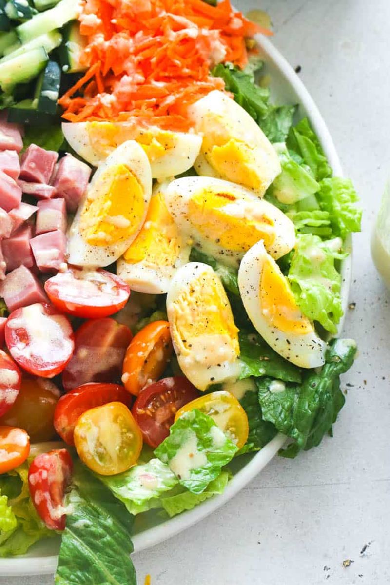 Salad Paired With Hard-Boiled Eggs and Olive Oil Dressing