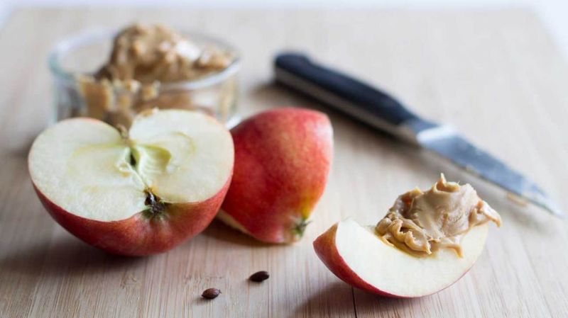 Apple Slices Paired With Peanut Butter