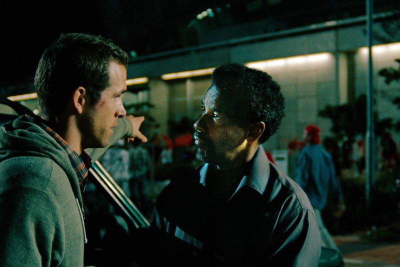 Ryan Reynolds and Denzel Washington in Safe House (2012)