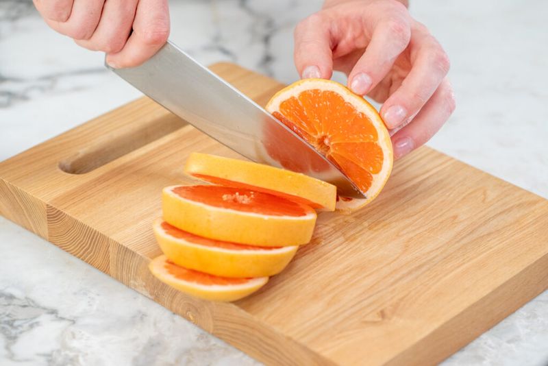 Sliced Fruit Eaten Off the Cutting Board