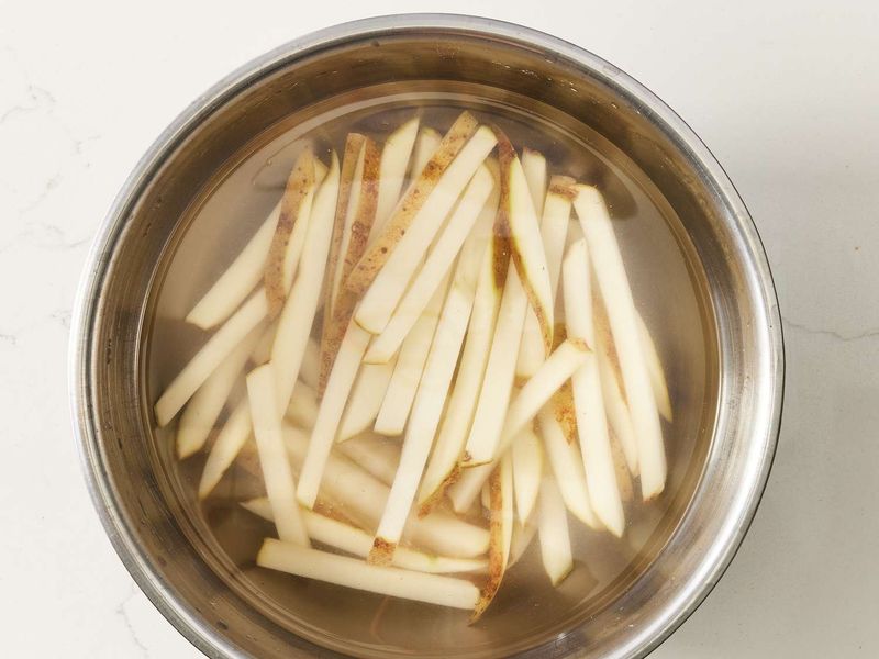 Soak Potatoes in Cold Water Before Frying