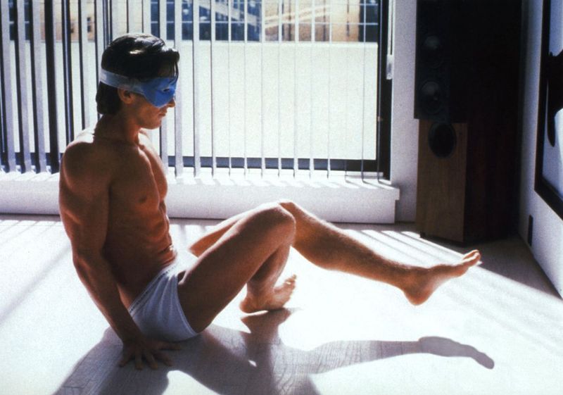 Patrick Bateman Reveals an Empty Surface in American Psycho (2000)